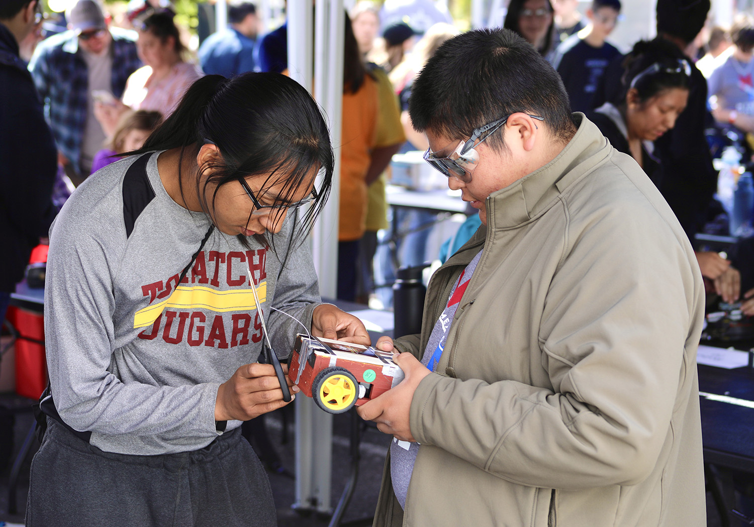 Students put the final tweaks on their robot.