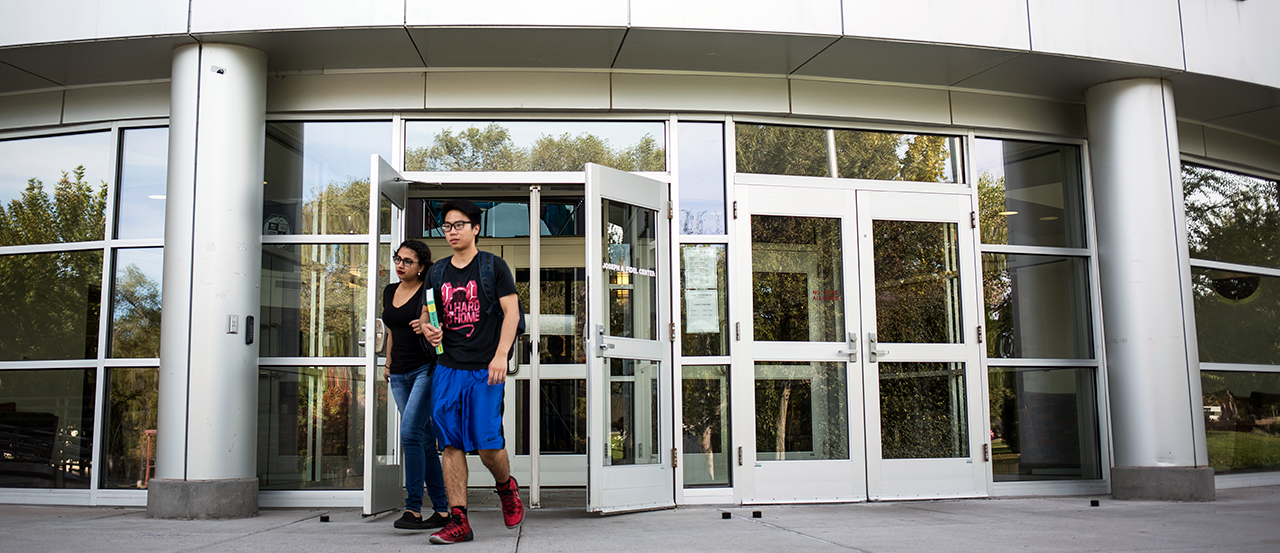 Hero image of students walking out of the Fidel Student Center